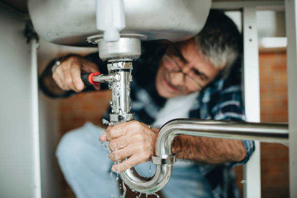 Plumber carrying out a repair