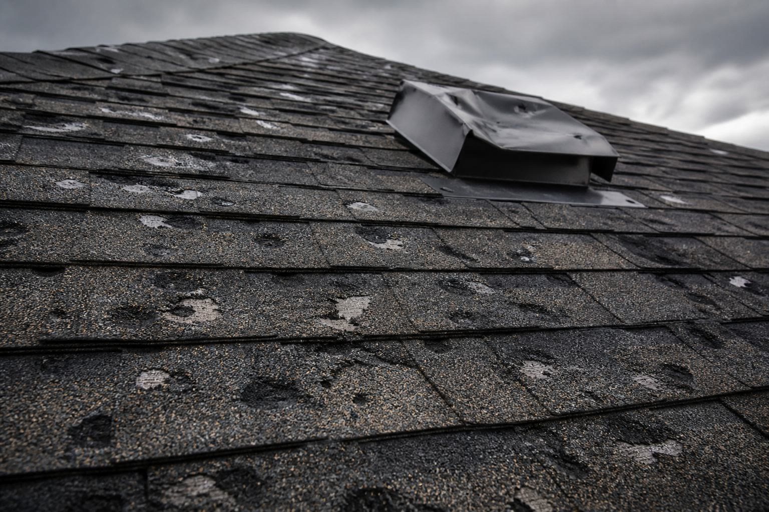 Hail impact marks on asphalt shingles
