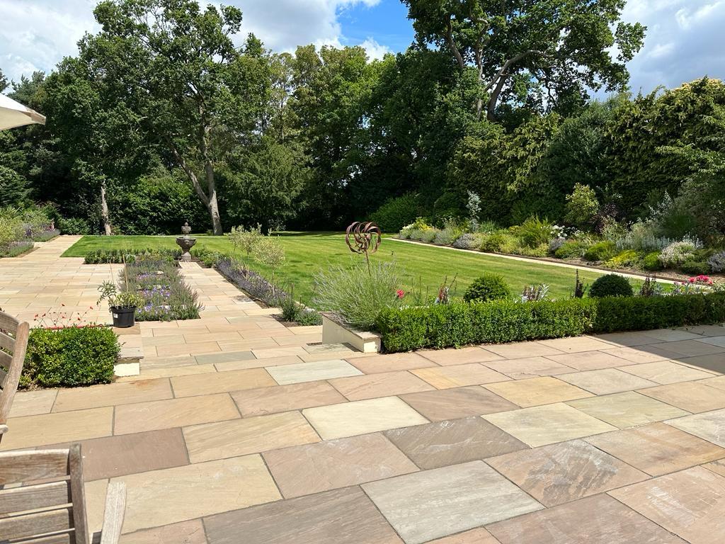 Paved patio with planted borders