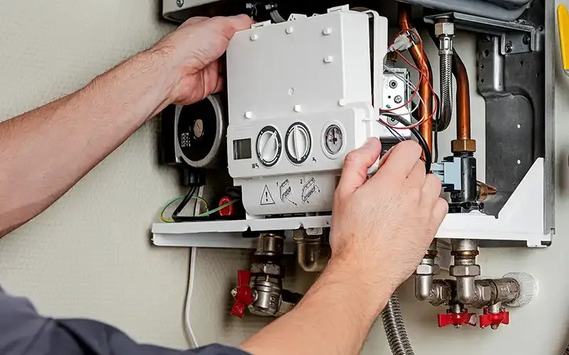 Engineer carrying out boiler maintenance