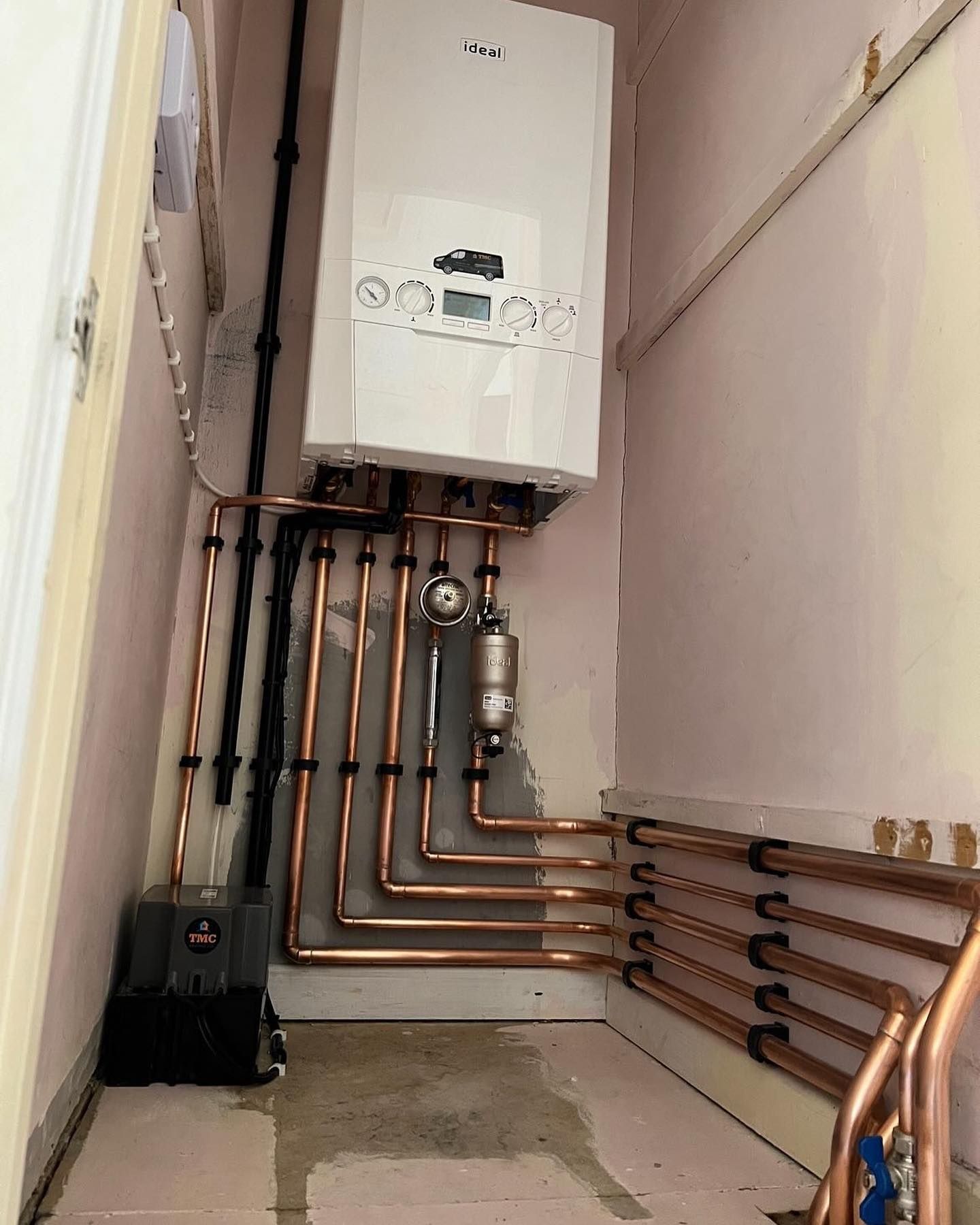 Heating engineer at work on a boiler