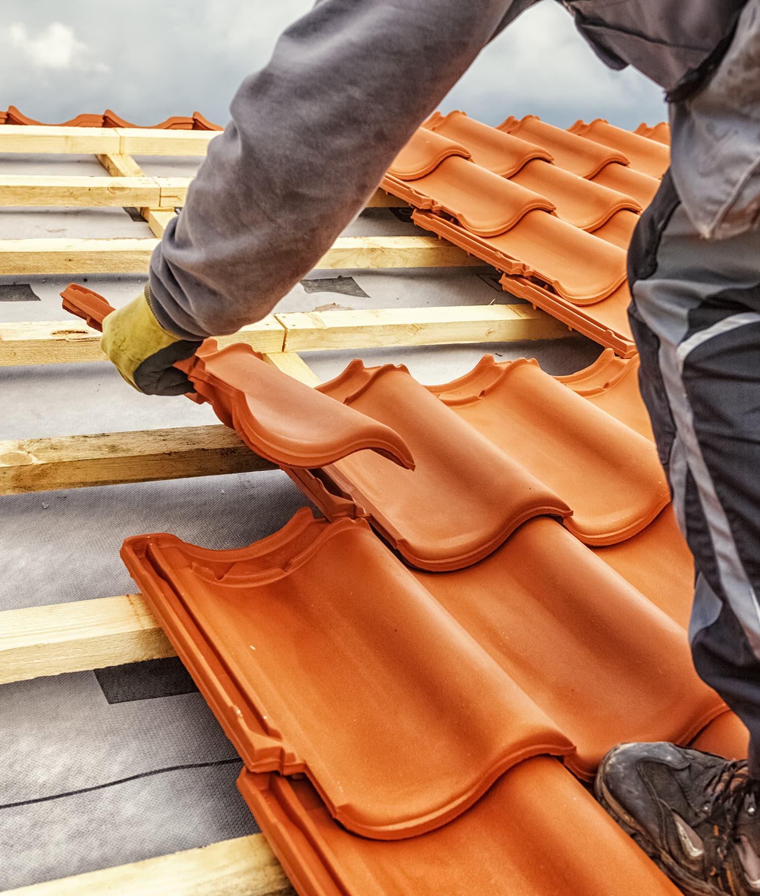 Roofer at work on a pitched roof