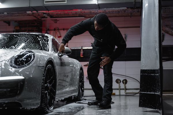 Car being washed with foam and water