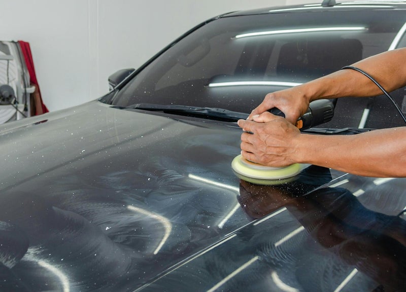 Machine polishing a black hood