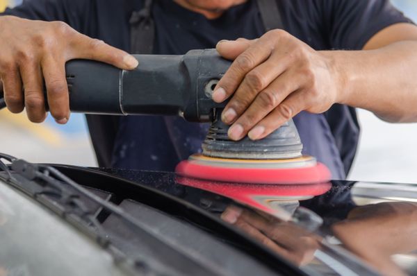 Polishing a black vehicle panel