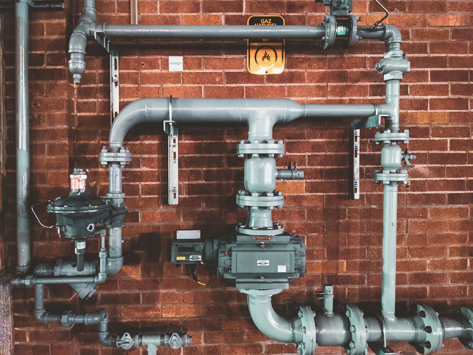 Plumber with tools on site — photo by Marianne Bos via Unsplash