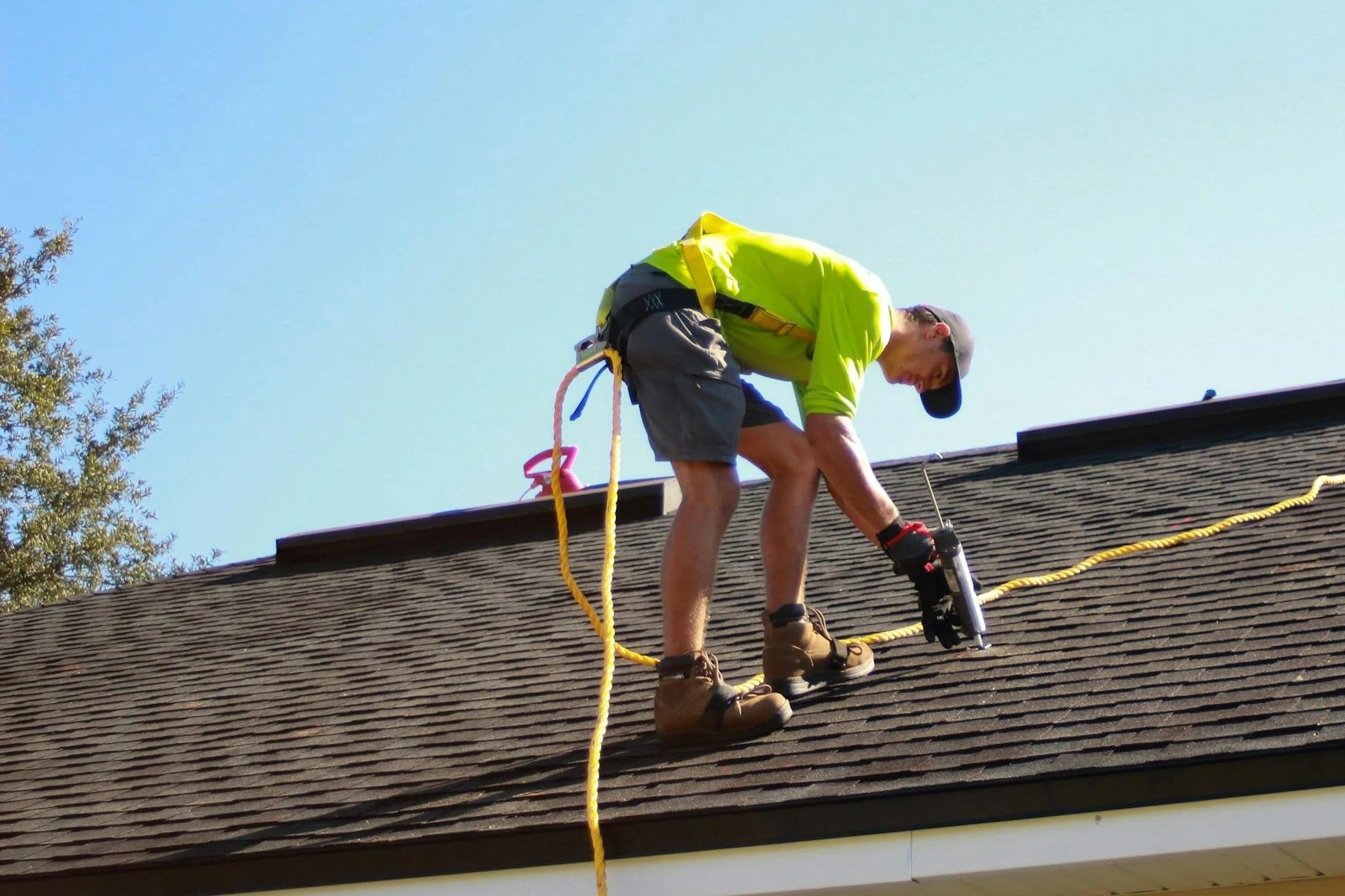 Roofer fitting a new roof in Manchester