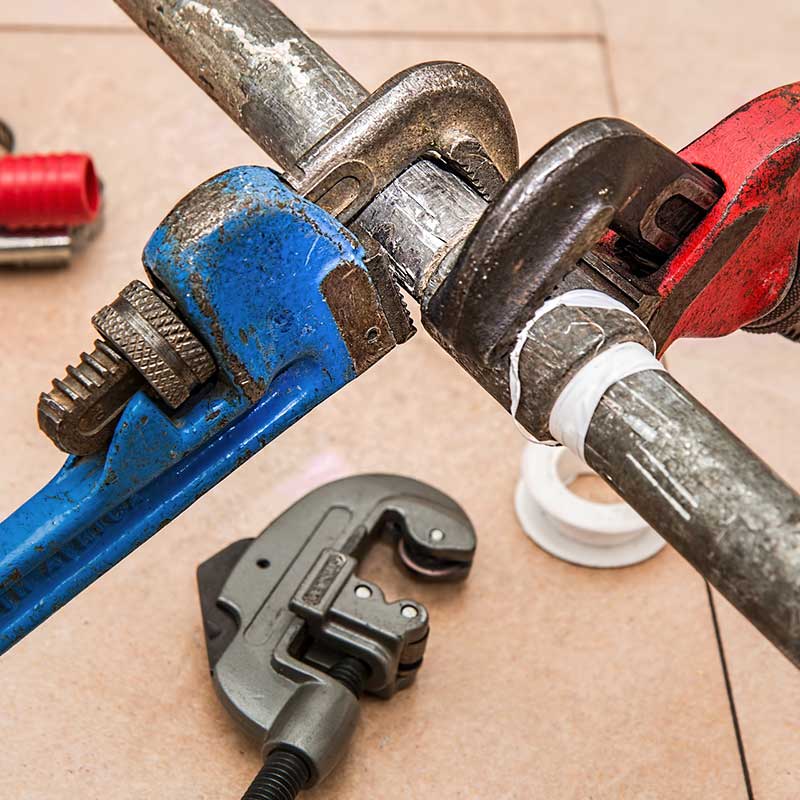 Pipe wrenches on a workbench