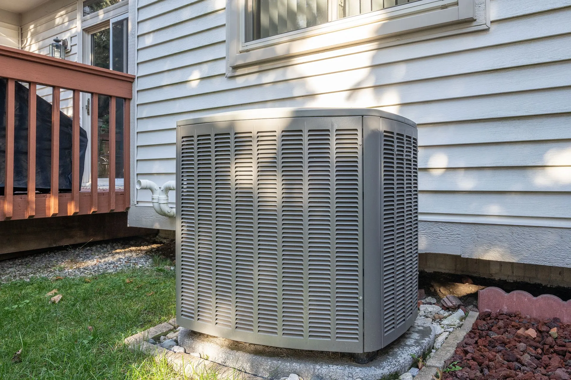 Air conditioner beside a home