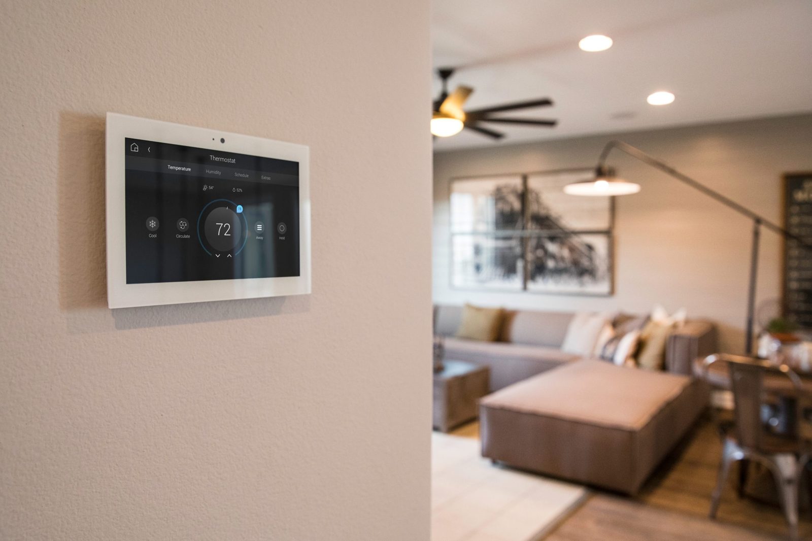 A smart thermostat in a living room