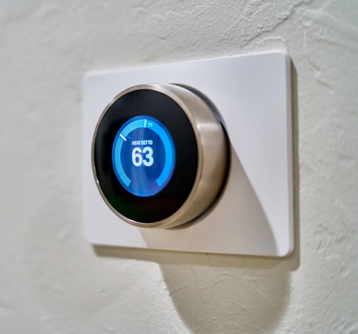 Smart thermostat on a hallway wall