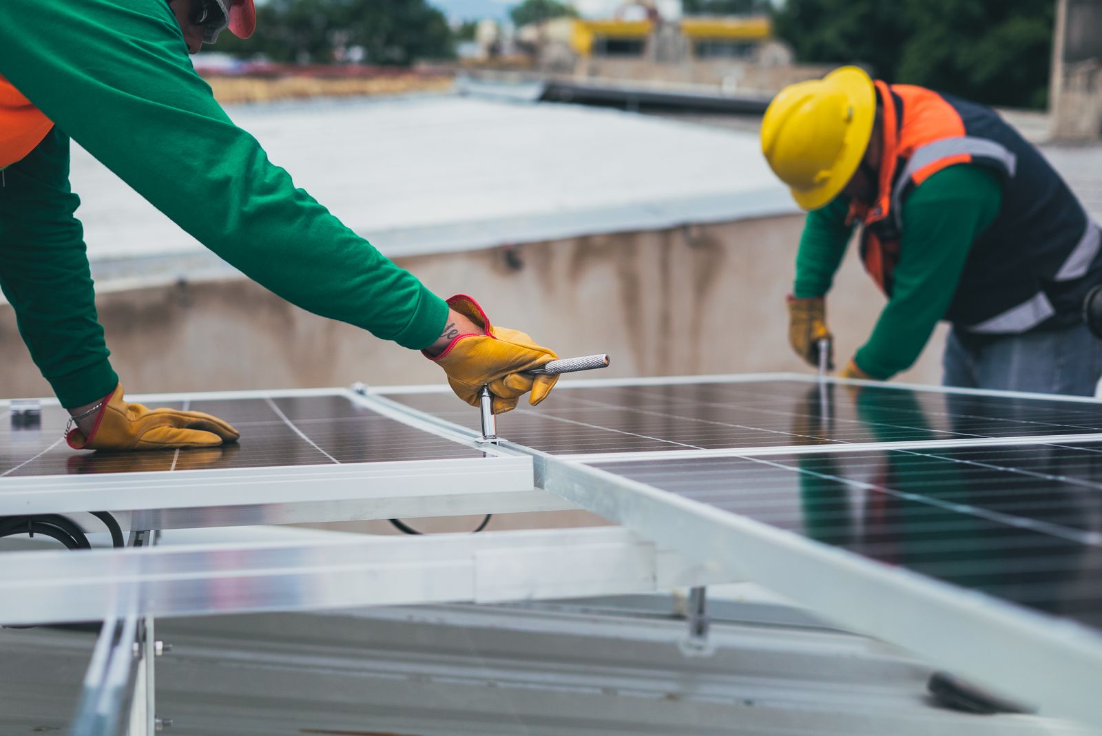 Illustrative photo — engineers installing solar panels on a roof