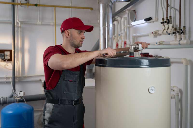Halo technician installing a new tank water heater