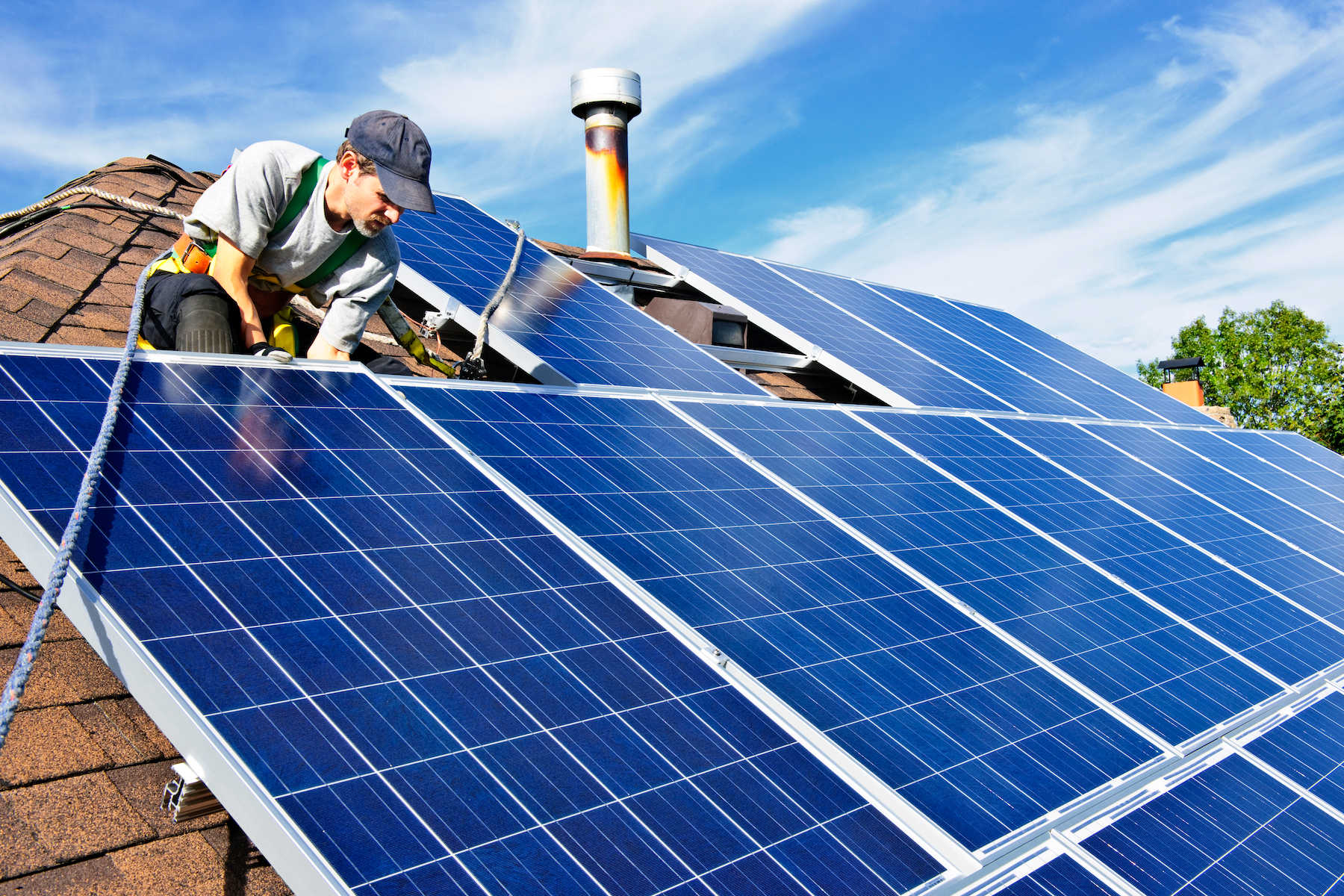 Engineer installing rooftop solar panels