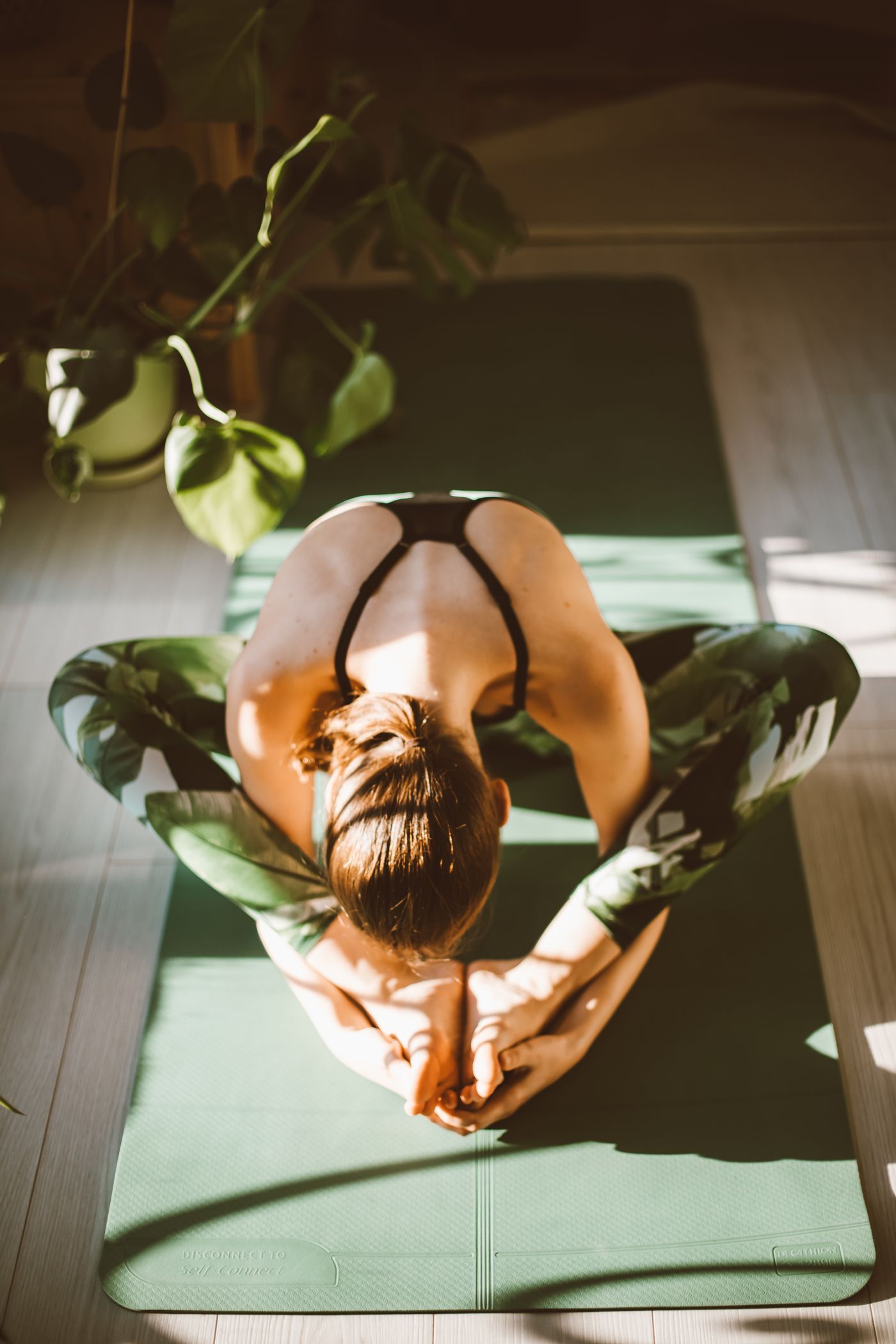 Student holding a standing yoga pose