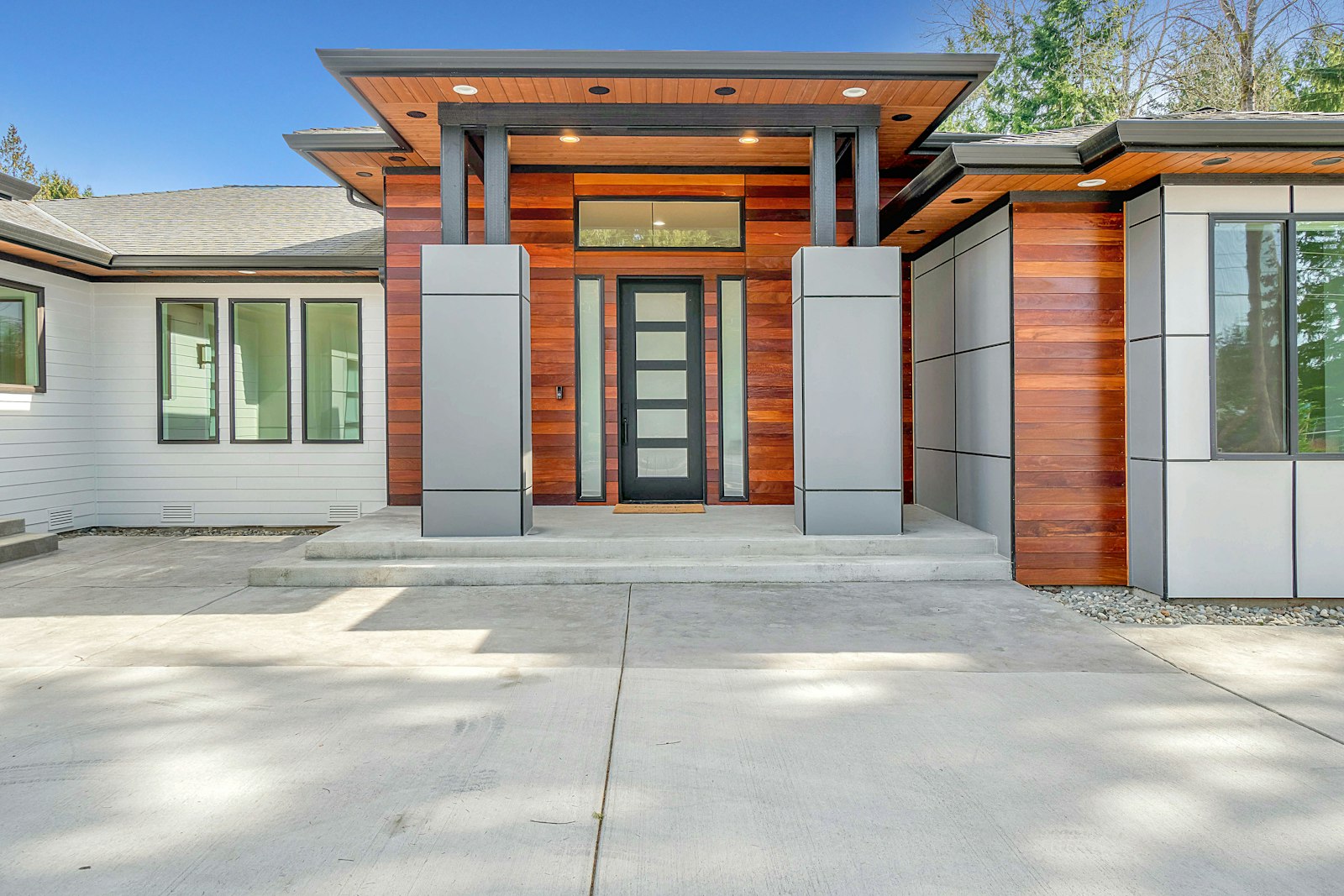 New concrete driveway and modern home entry (sample image)