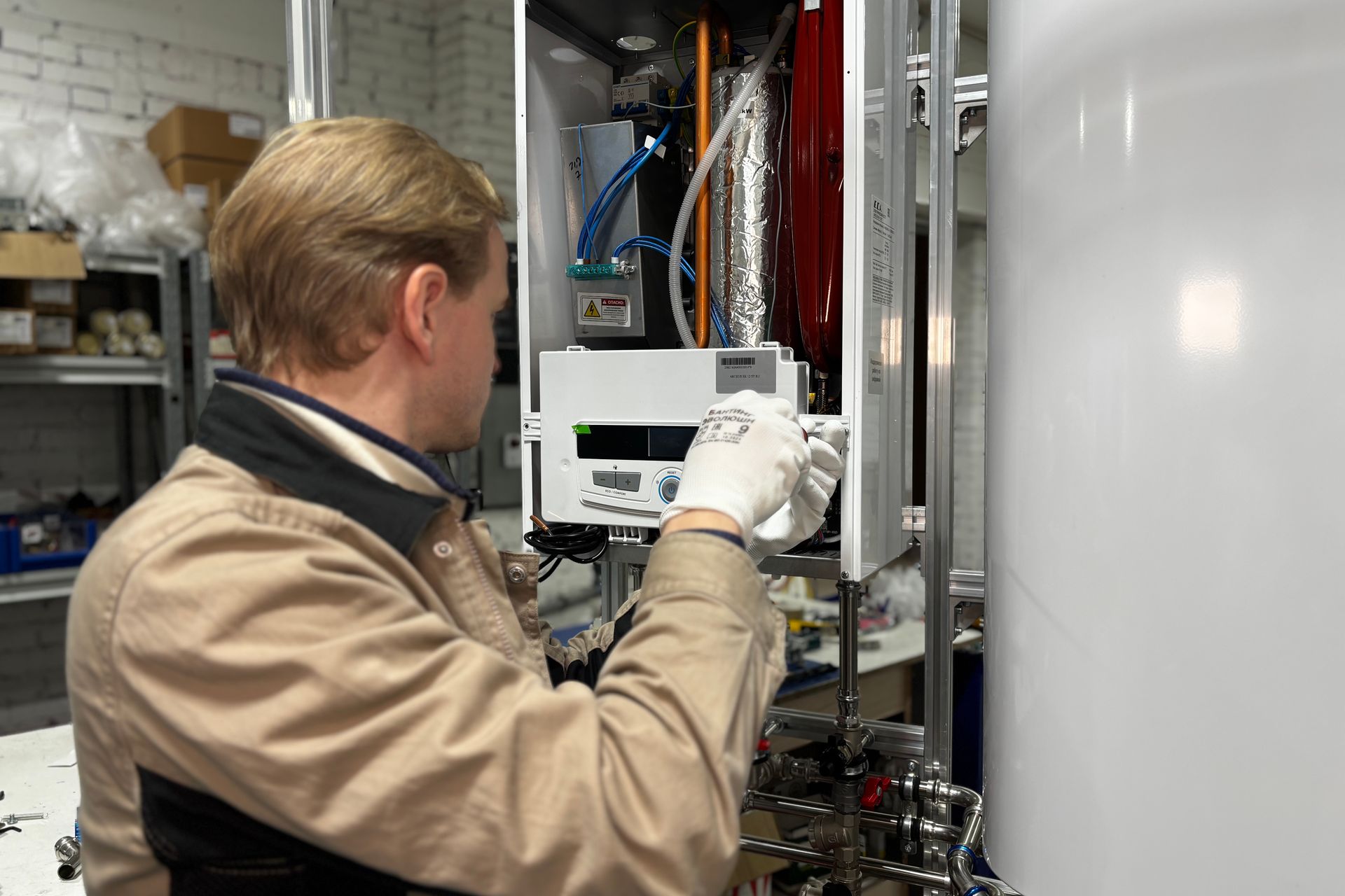 Heating engineer servicing a domestic boiler