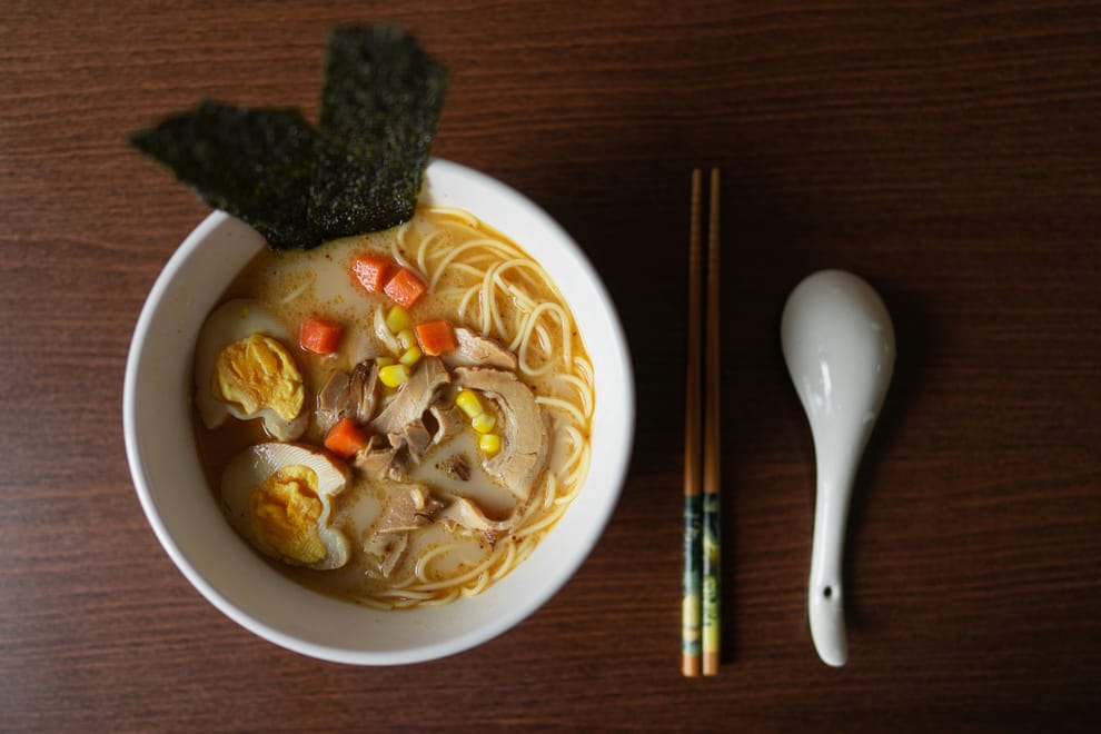 Bowl of ramen with egg, chashu, corn and nori