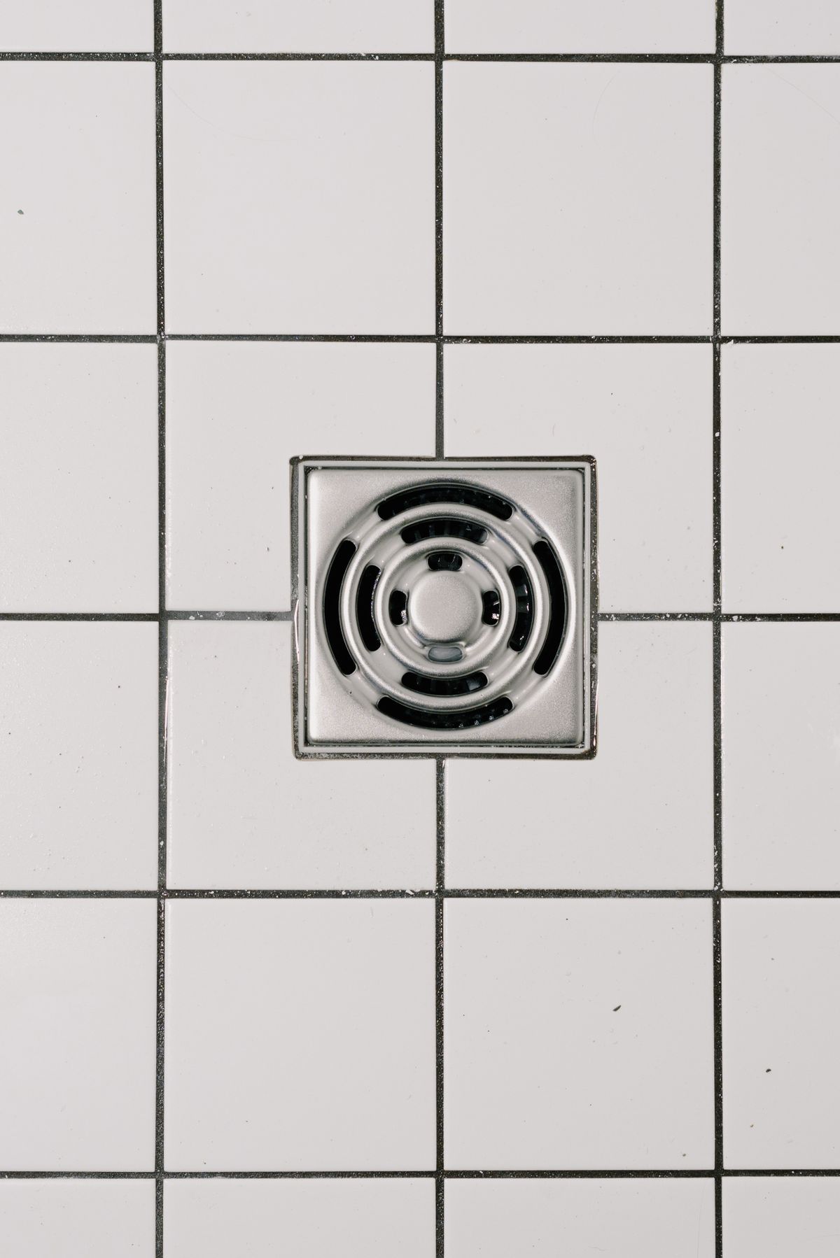 Floor drain set in tile, photographed from above