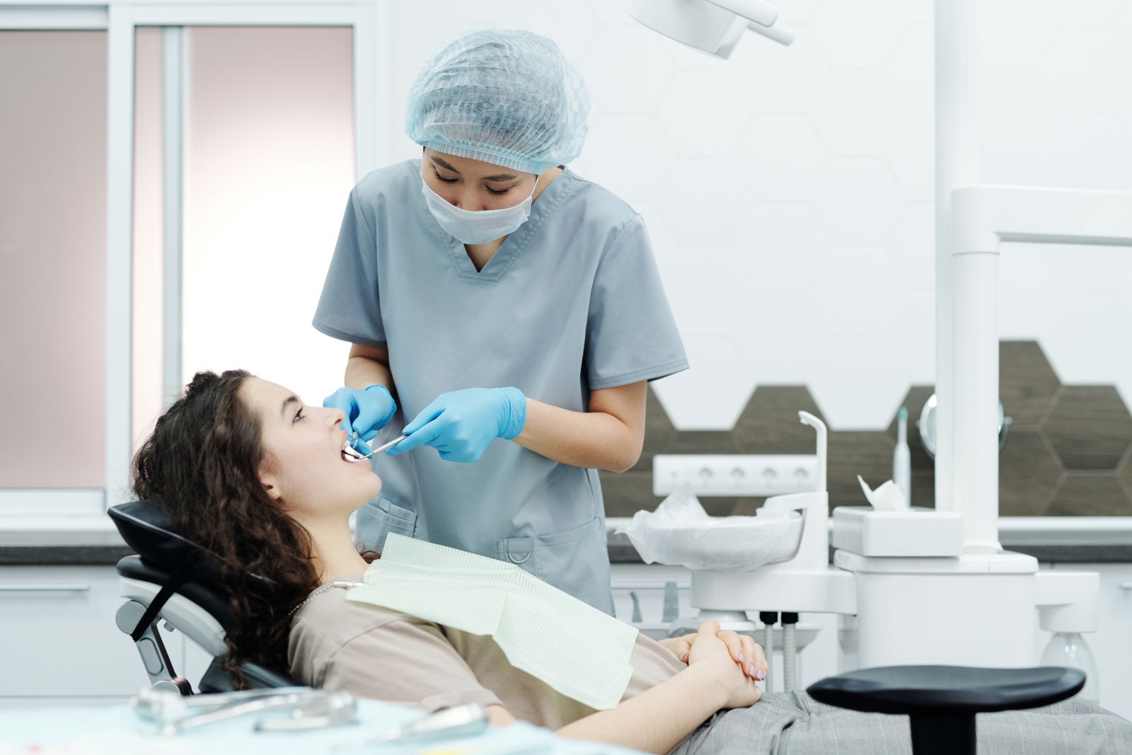 Dentist providing gentle treatment
