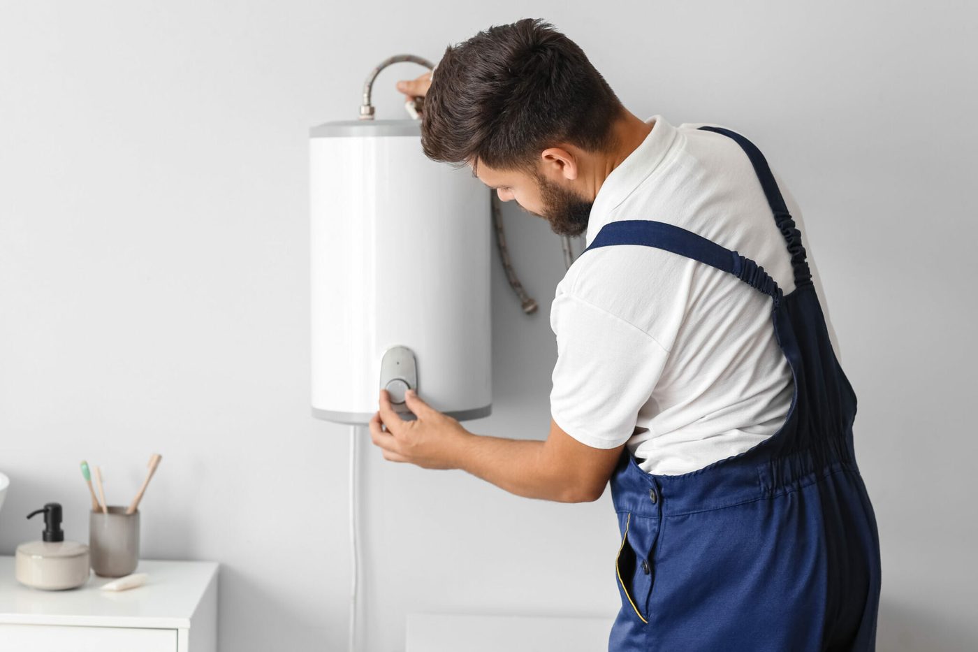 Technician servicing a water heater