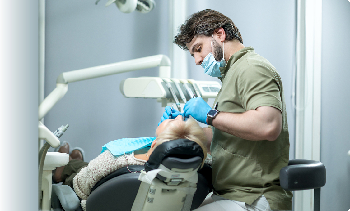 Dentist treating a patient in a modern Austin dental operatory