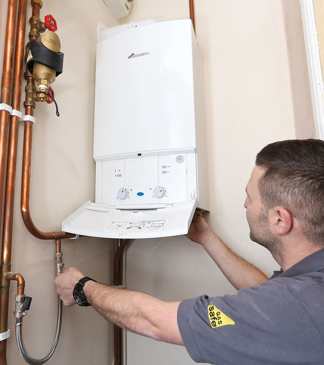 Heating engineer servicing a domestic boiler