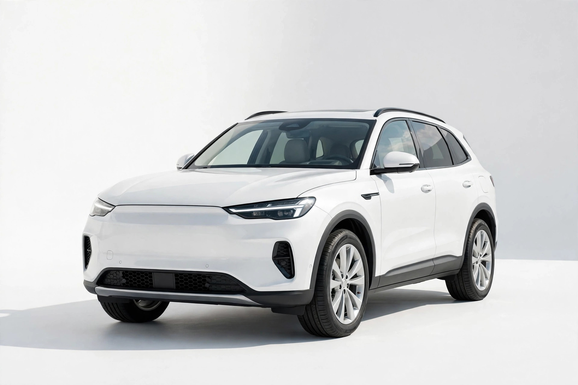 White SUV in a bright studio after detailing