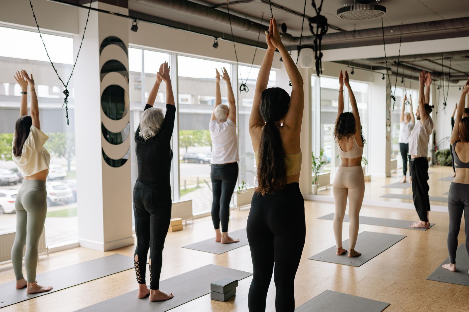 A yoga class in session at a bright studio