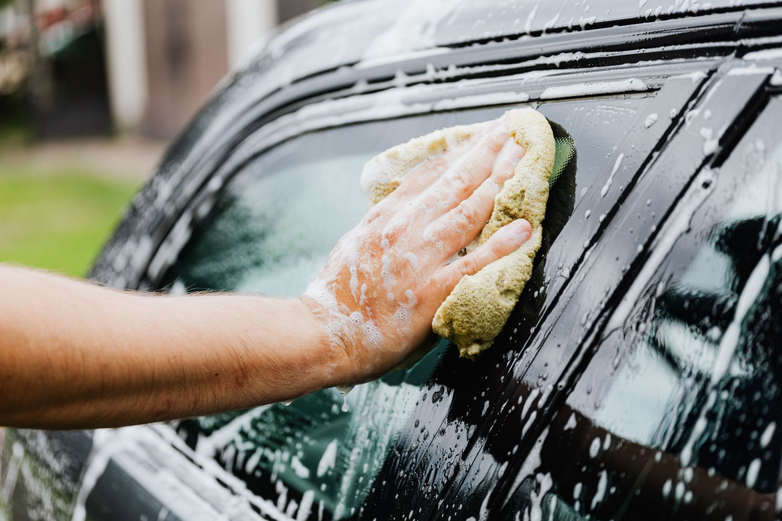 Car being washed with foam at a detailing studio