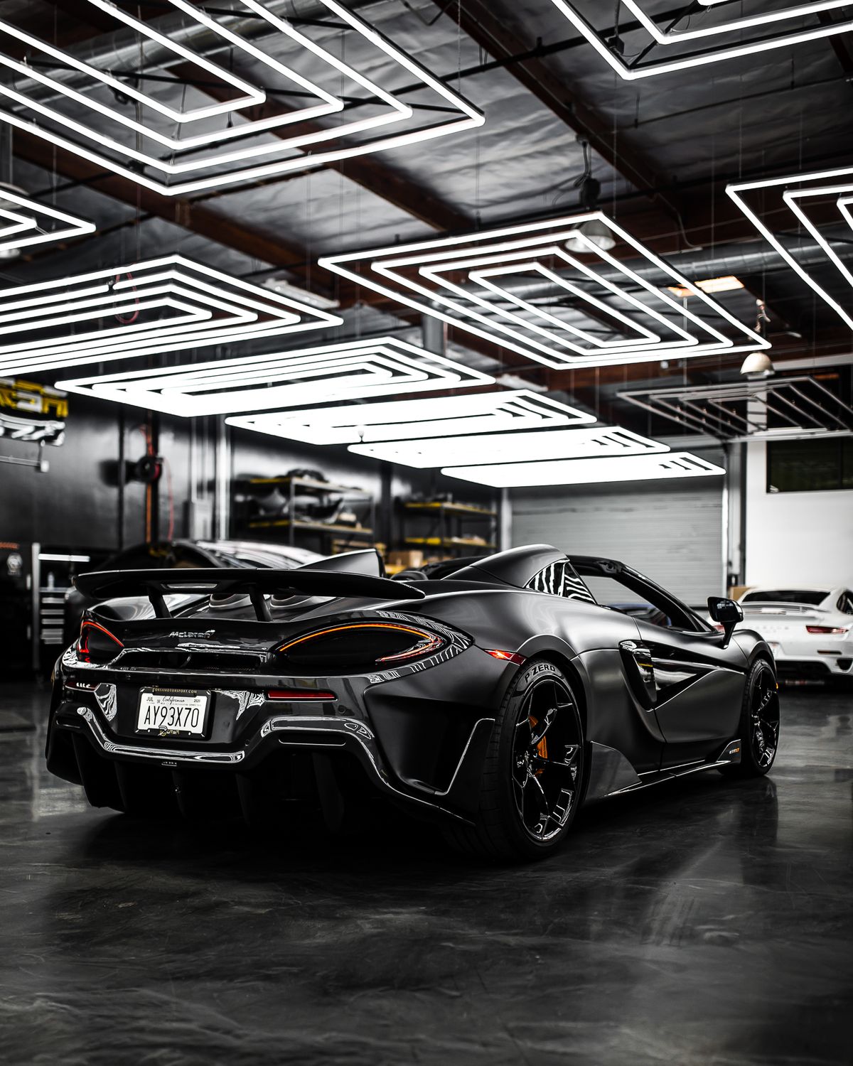 Sports car in a dark detailing studio