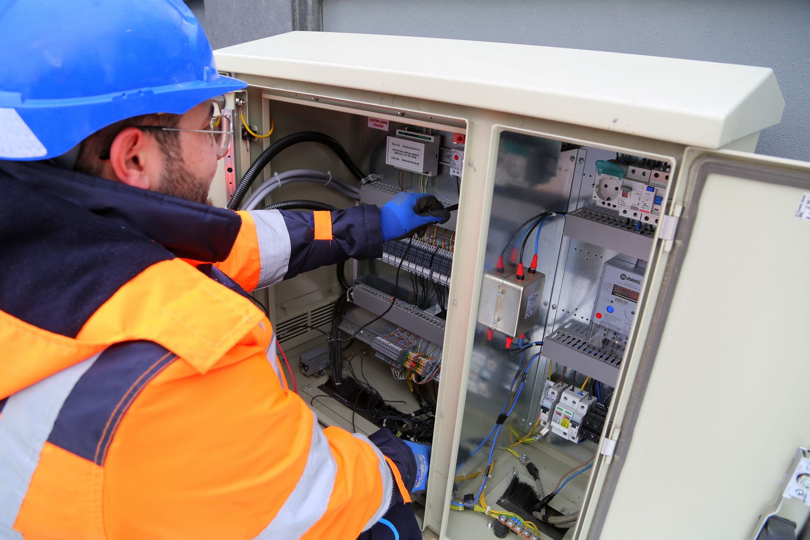 Electrician testing a commercial fuse box