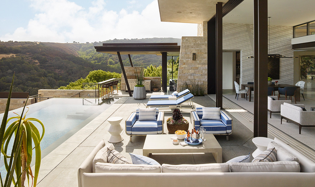 Poolside entertaining area with loungers and outdoor living space