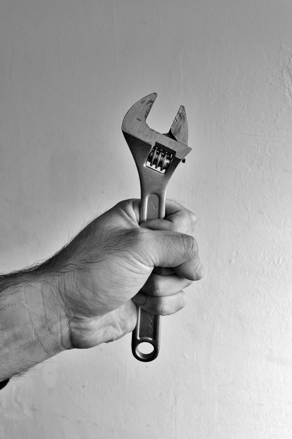 Wrench in hand, ready for work