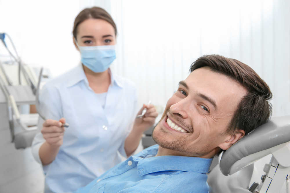 Dentist consulting with a patient
