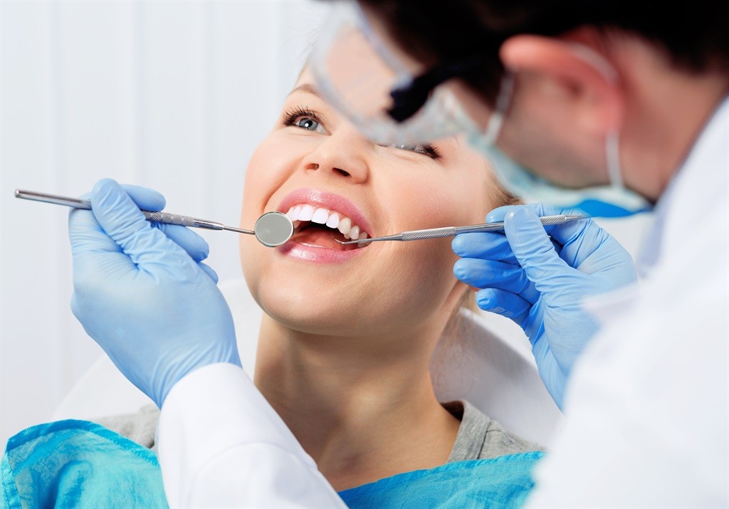 Dentist performing a tooth filling