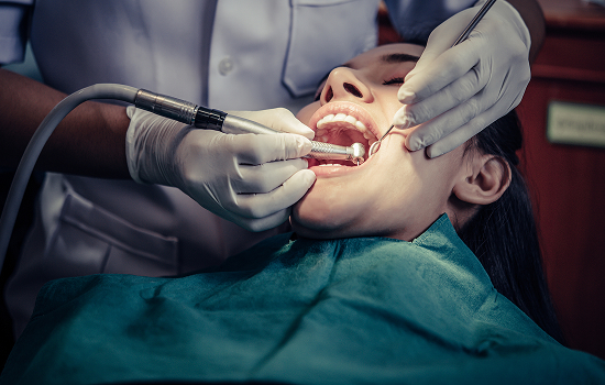 Dentist treating a patient's teeth