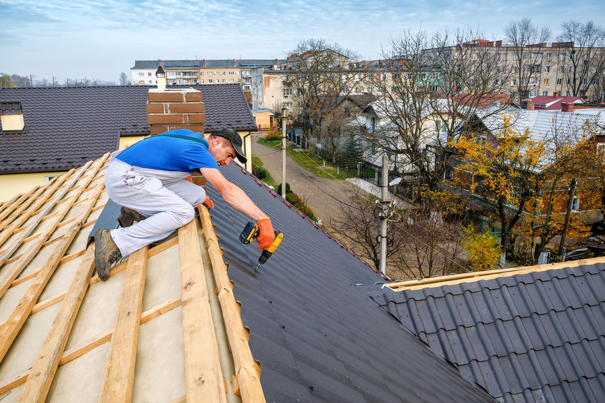 Roofer at work on a pitched roof